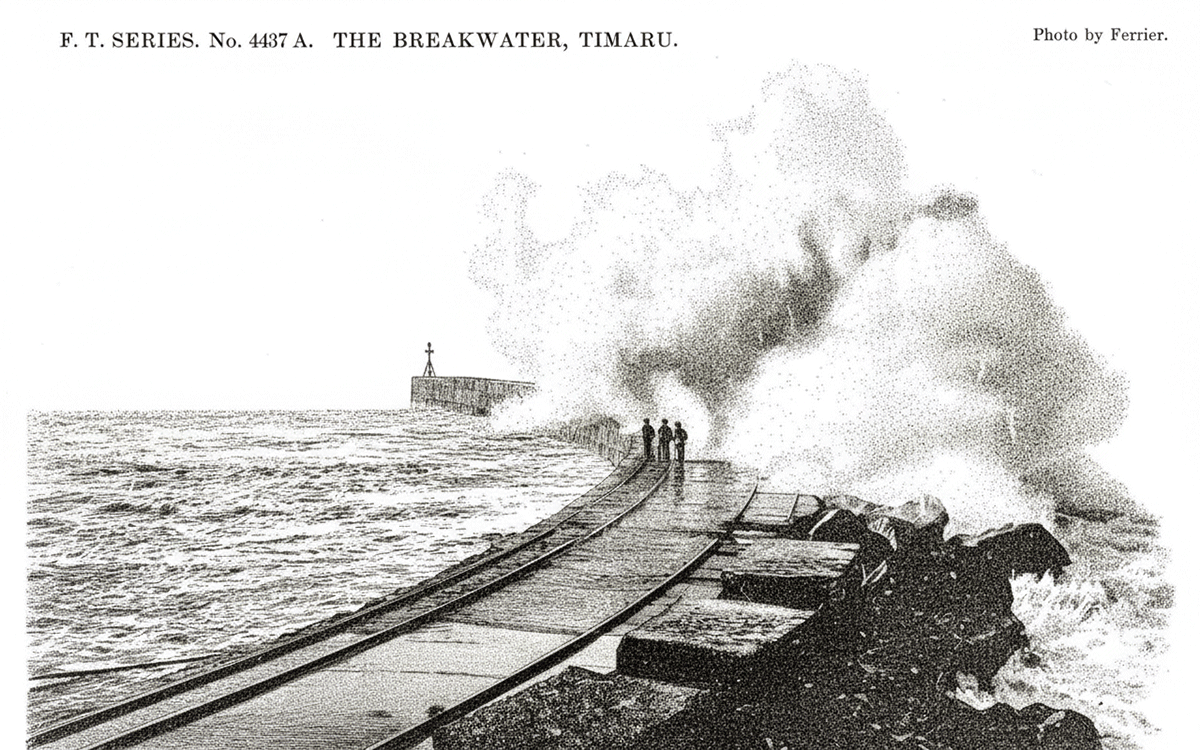 Surf breaking over the new harbour